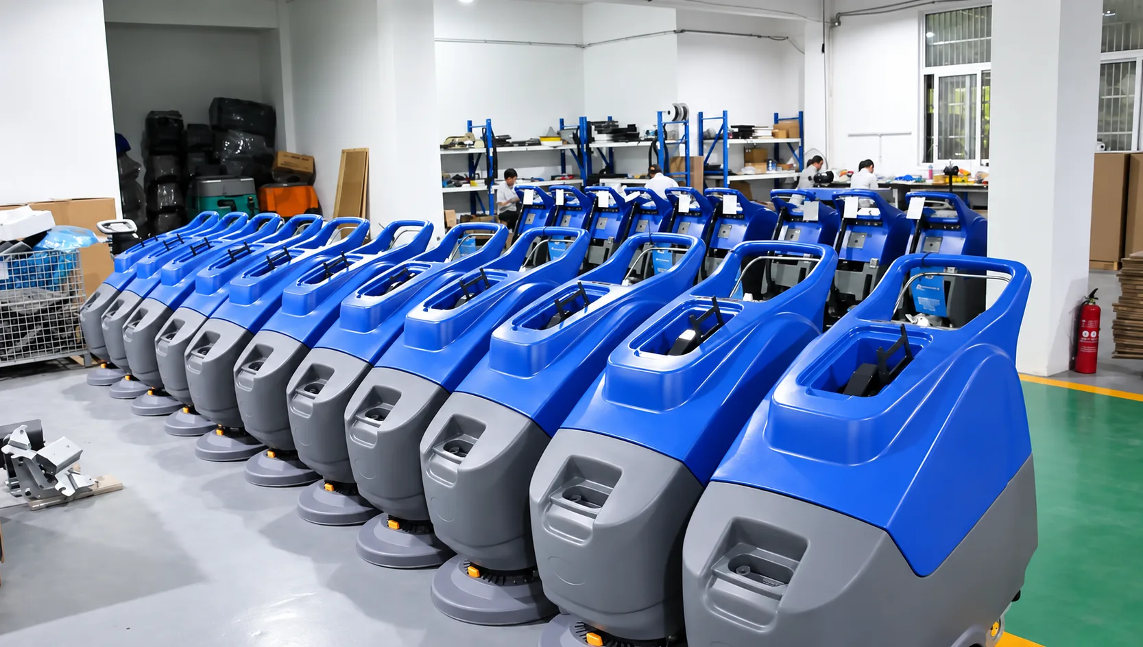 Rows of WeClean industrial floor scrubbers at the company factory